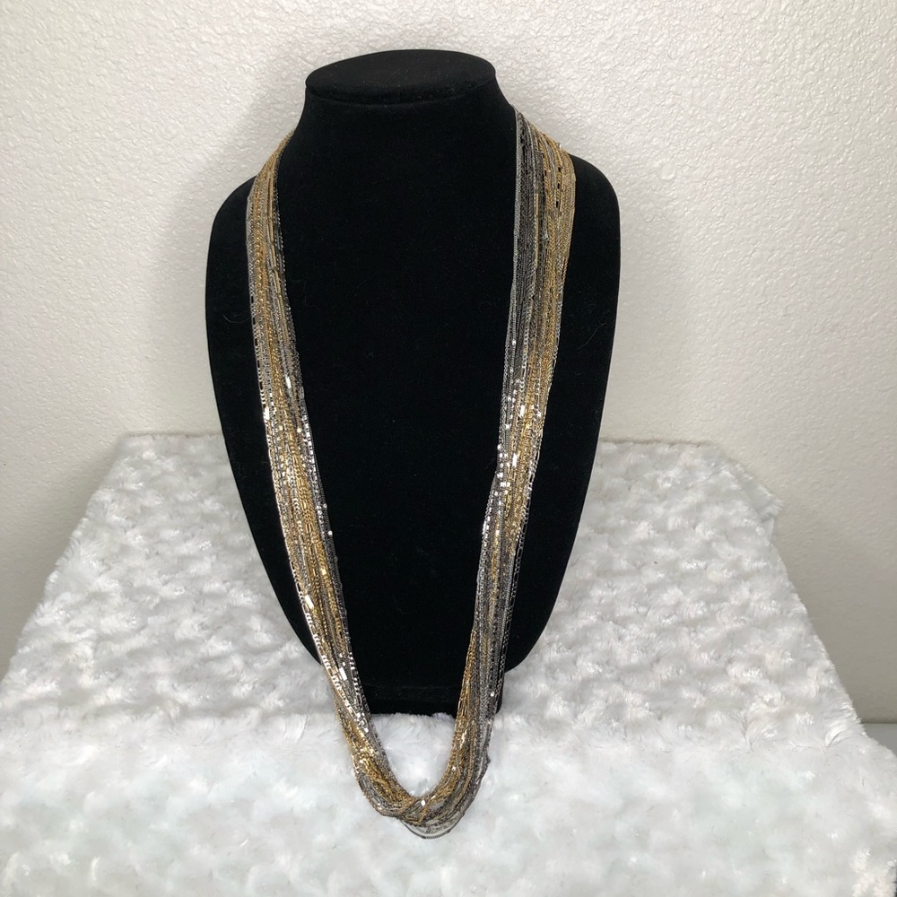 Multi - Strand Gold/Silver/Pewter necklace 
No name brand